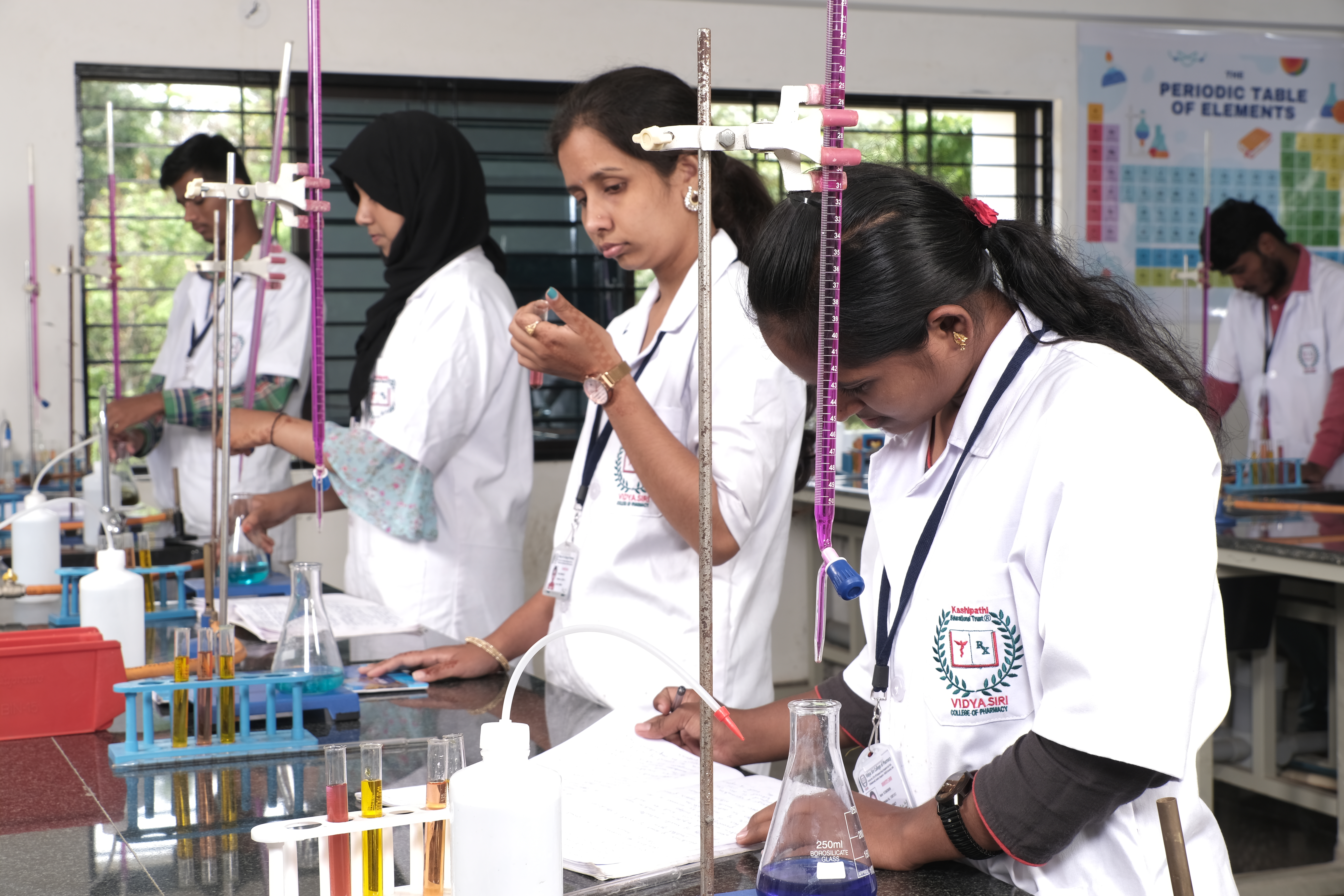 Image of a pharmacy student studying in a lab at Vidya Siri College of Pharmacy