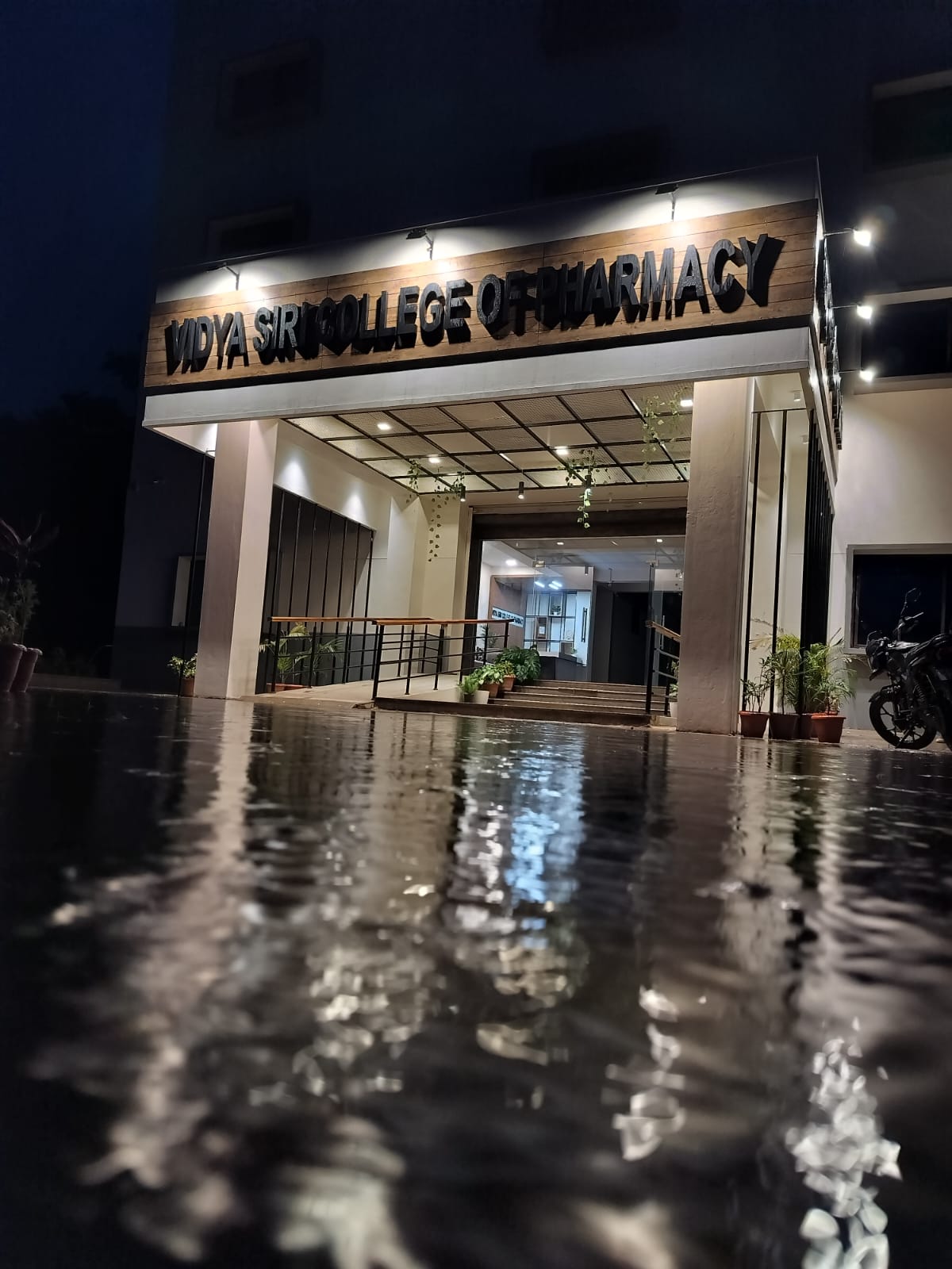 College entrance with name board - Vidya Siri College of Pharmacy