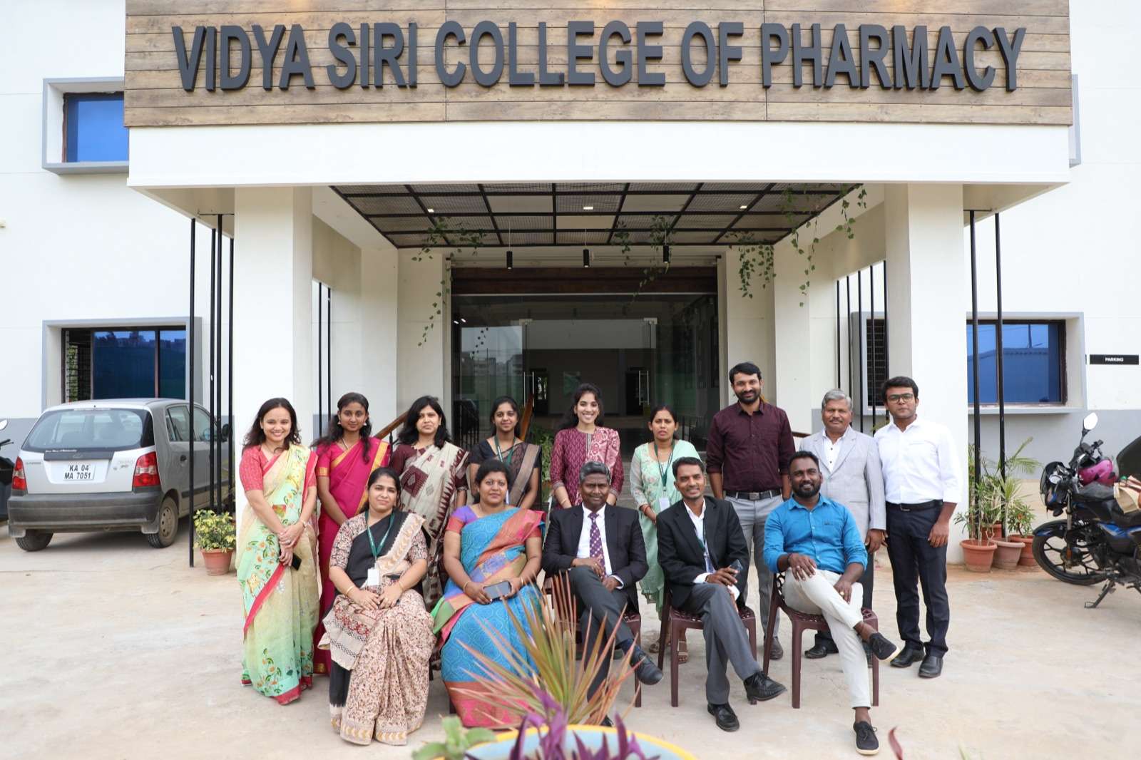 Staff and students of Vidya Siri College of Pharmacy in front of the campus building on Sarjapur Road Bangalore